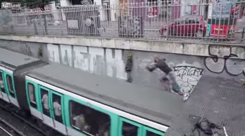 man-jumps-on-top-of-train02